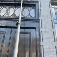Home Water-fed pole cleaning the exterior windows of a shop front in Haringey.
